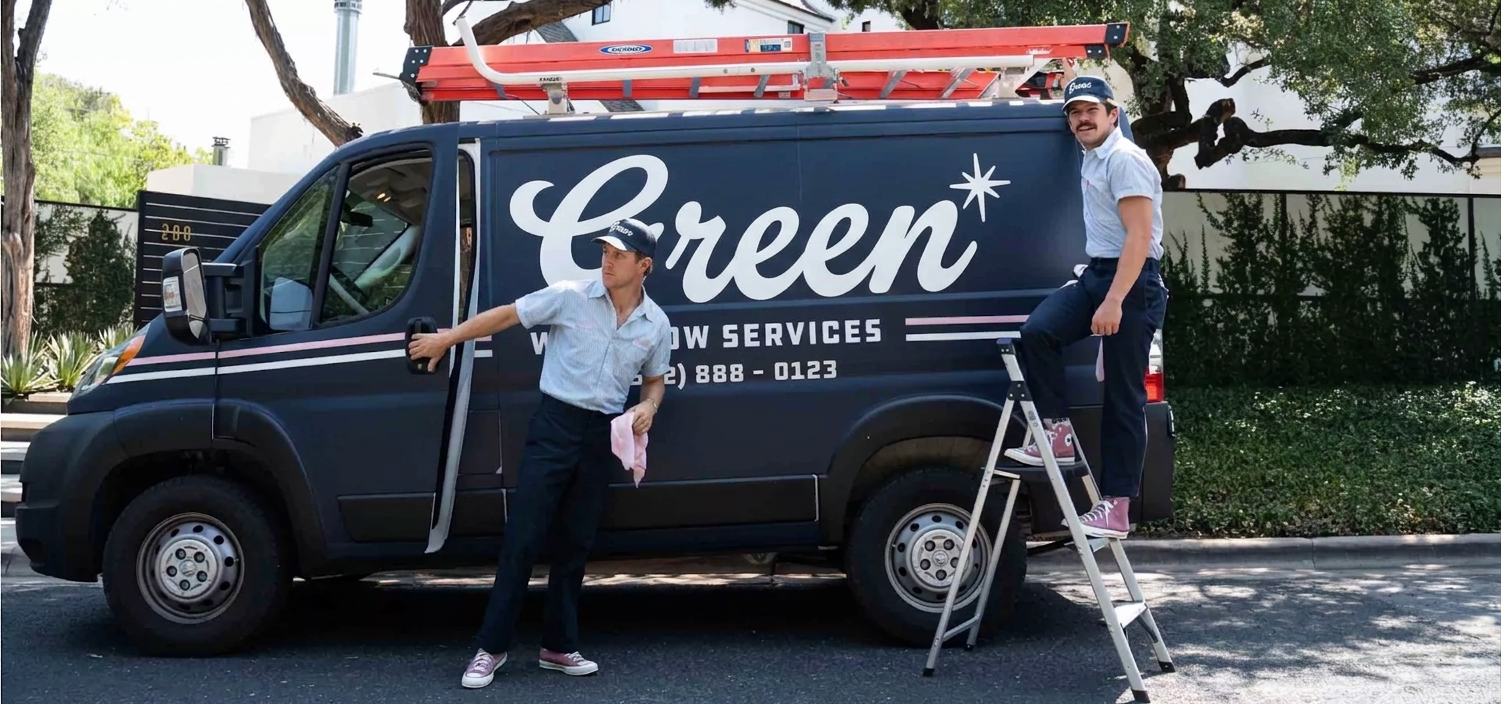 Two window cleaning colleagues beside their work van