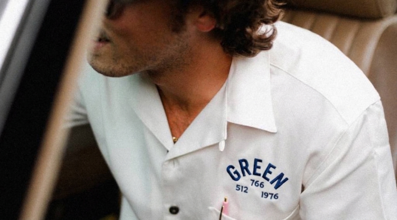 A Green technician wearing the classic work shirt